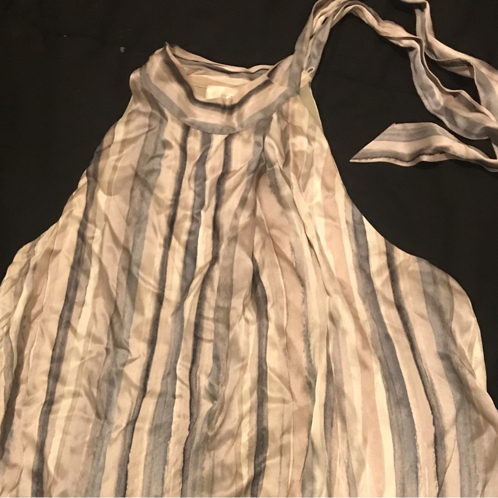 A designer blouse with marbled effect, size xs and with satin fabric